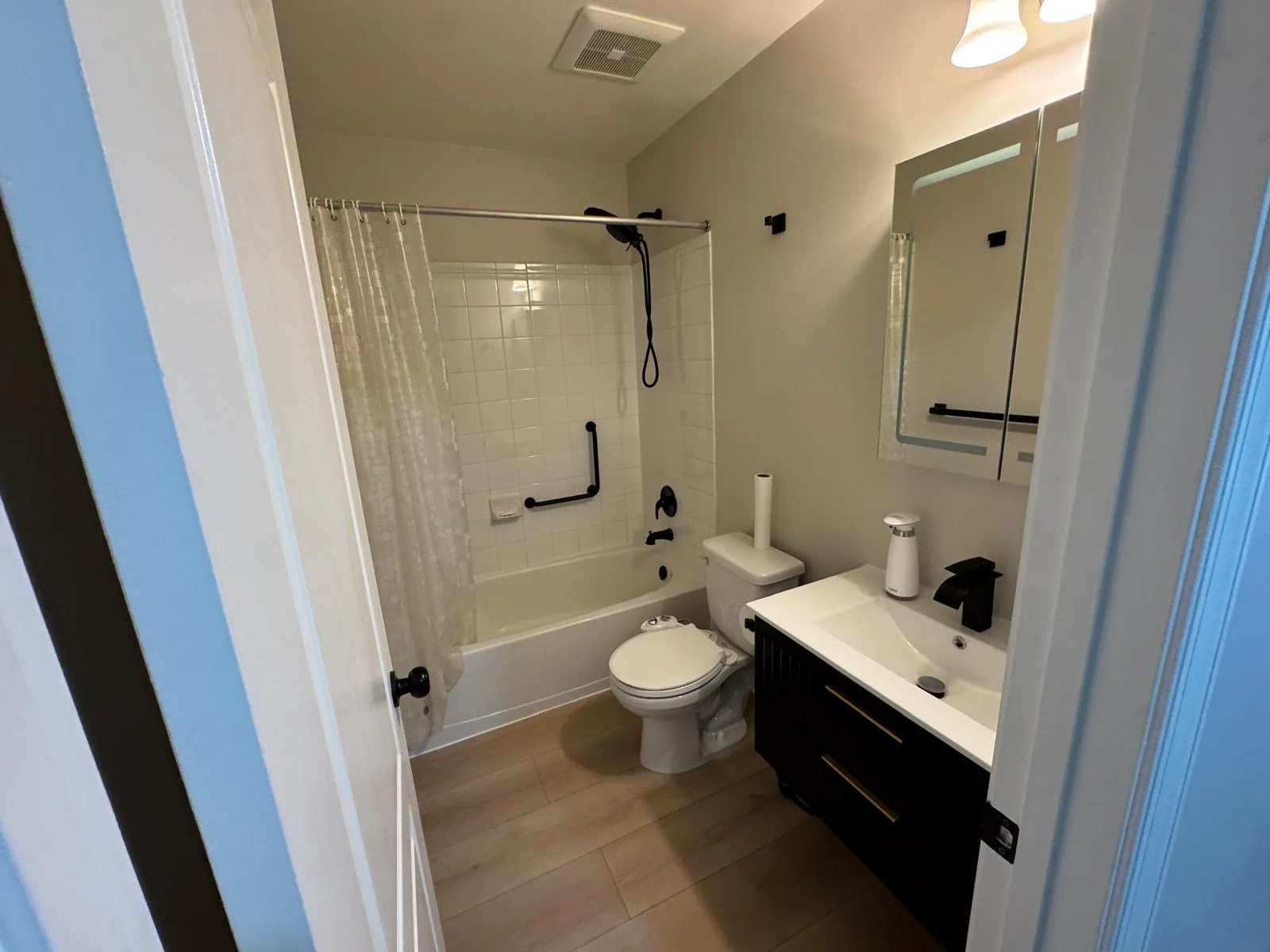 Completed bathroom with updated vanity, fixtures, and finishes