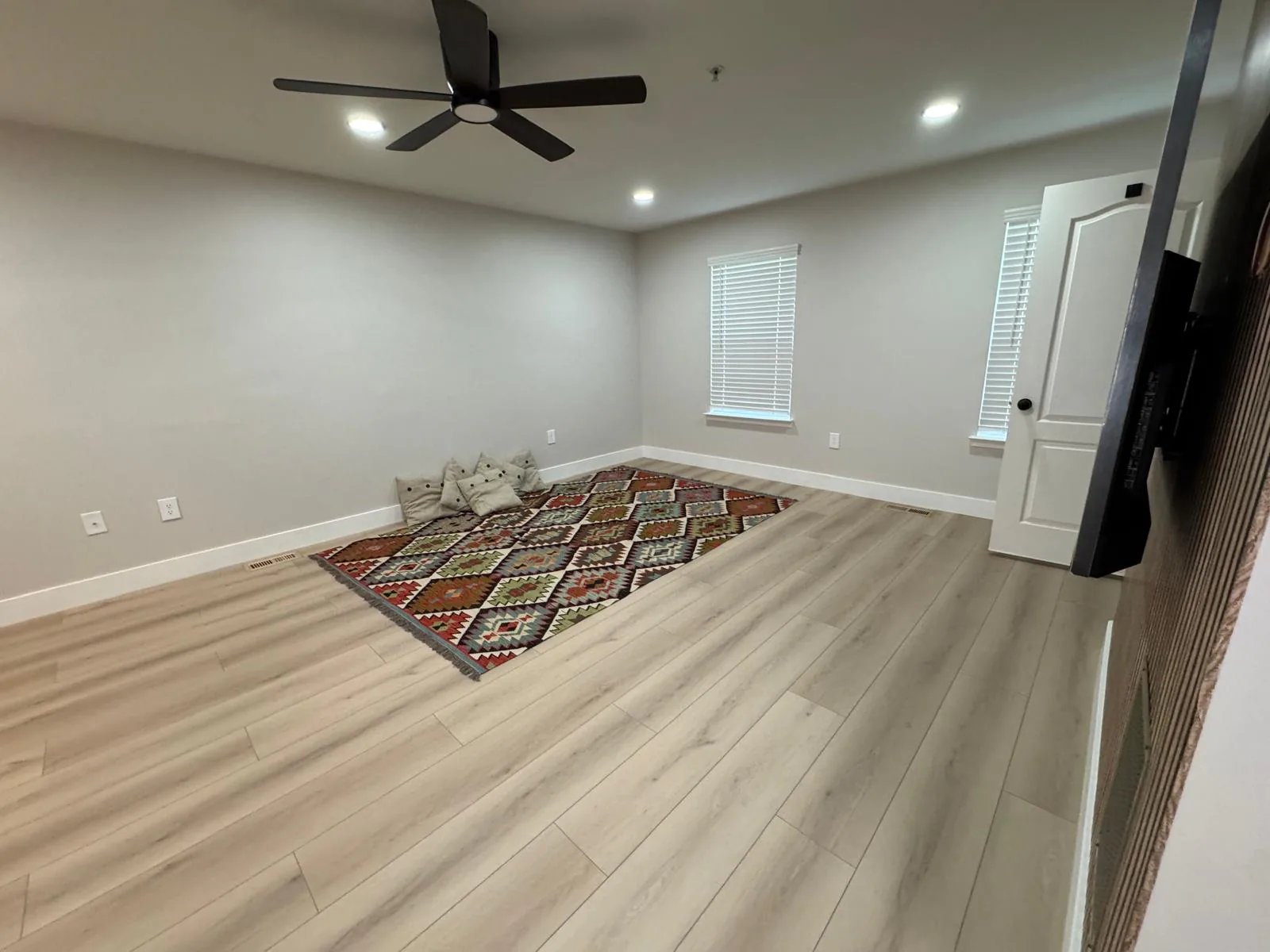 Completed room with luxury vinyl plank flooring and painted walls