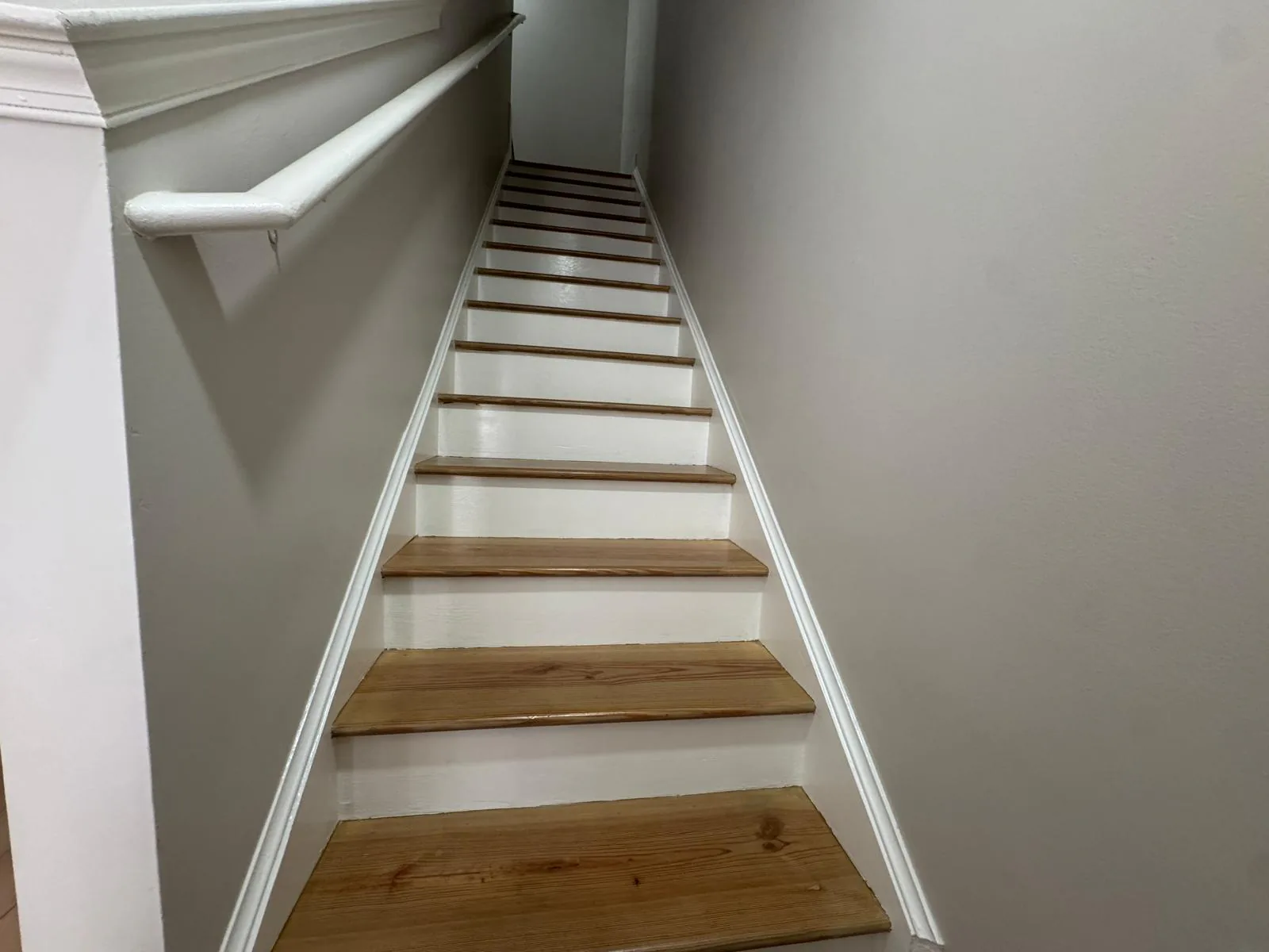 Completed staircase with repaired and stained wood treads