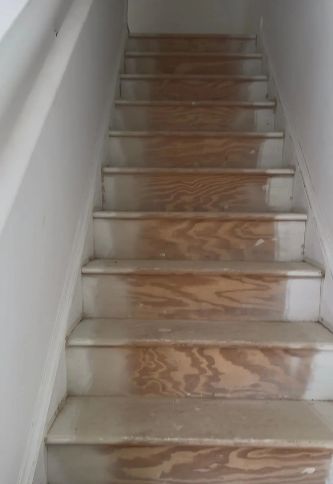Interior staircase before repair and staining