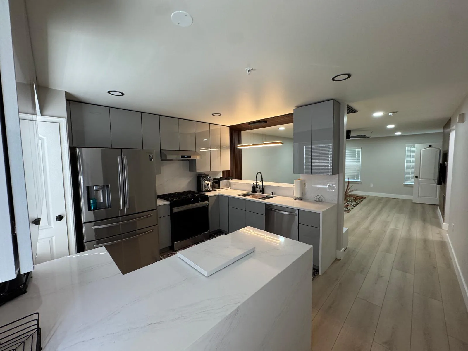 Completed kitchen renovation with updated cabinets, counters, and flooring